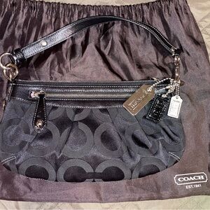 The NWOT Coach Vintage Madison Op Art Small Hobo Bag in black canvas silver hw